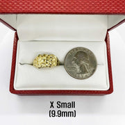 10k - 14k Gold ring in a red box with a coin for size reference on a white background
