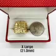 10k - 14k gold nugget ring inside a red jewelry box place beside a coin for comparison