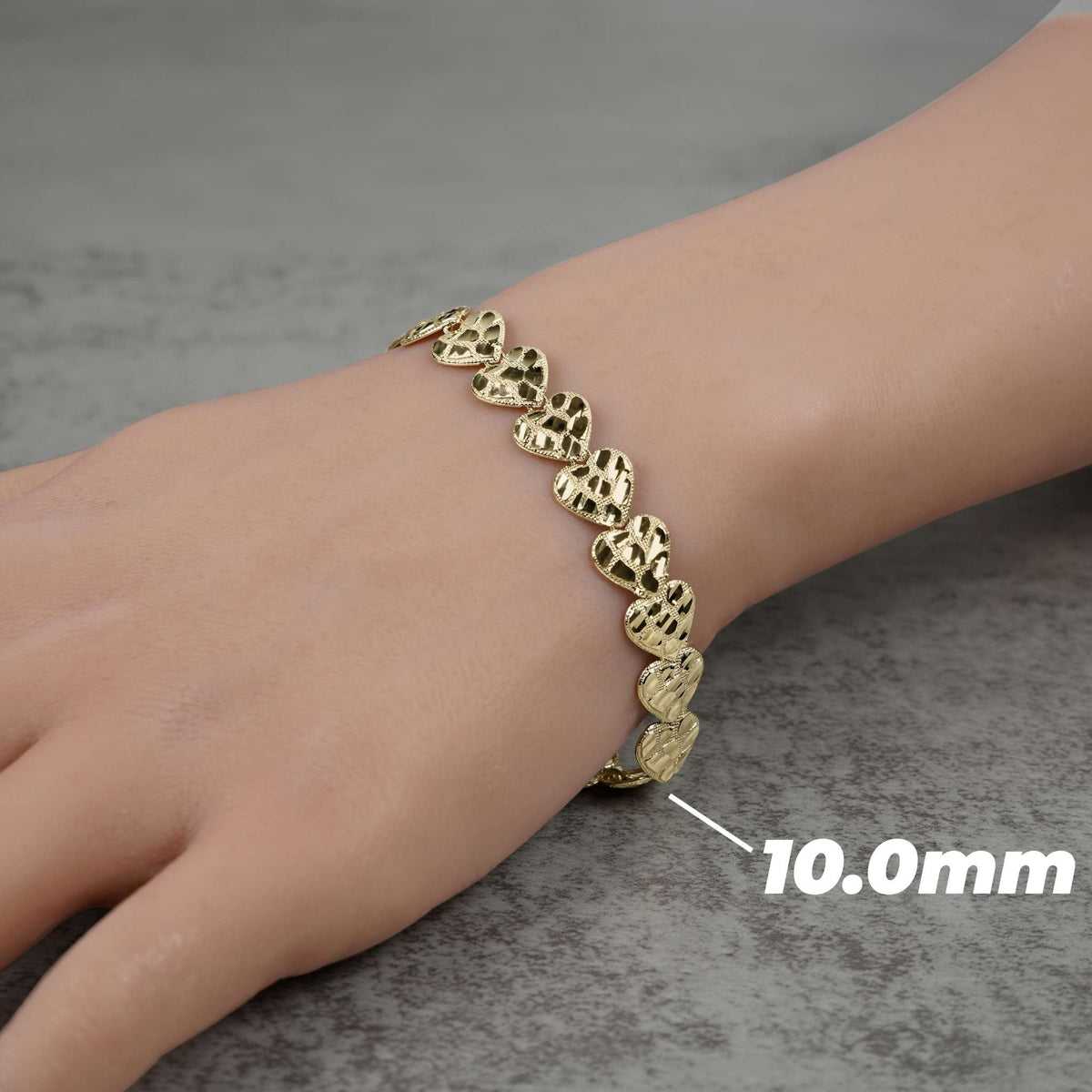 10.0mm yellow gold nugget heart chain bracelet displayed on a model's wrist.