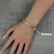 Top-down view of a 10.0mm gold nugget heart link bracelet on a hand.