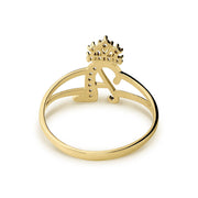 Top-down view of a gold crown cursive initial ring featuring cubic zirconia settings.