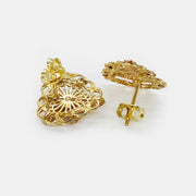 Back view of two-tone gold heart stud earrings showing secure earring posts and backs.