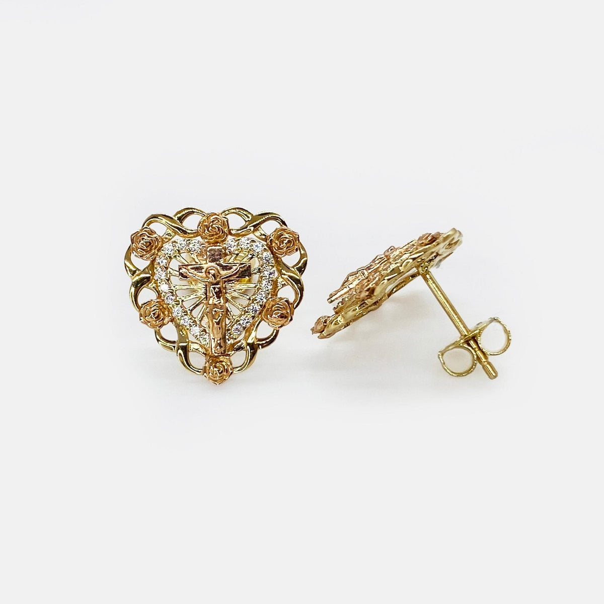 Two-tone yellow and rose gold heart stud earrings featuring a center crucifix and roses.