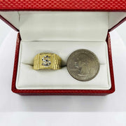 10k - 14k Gold Rollie Band ring with dollar sign design next to a quarter in an open red box.