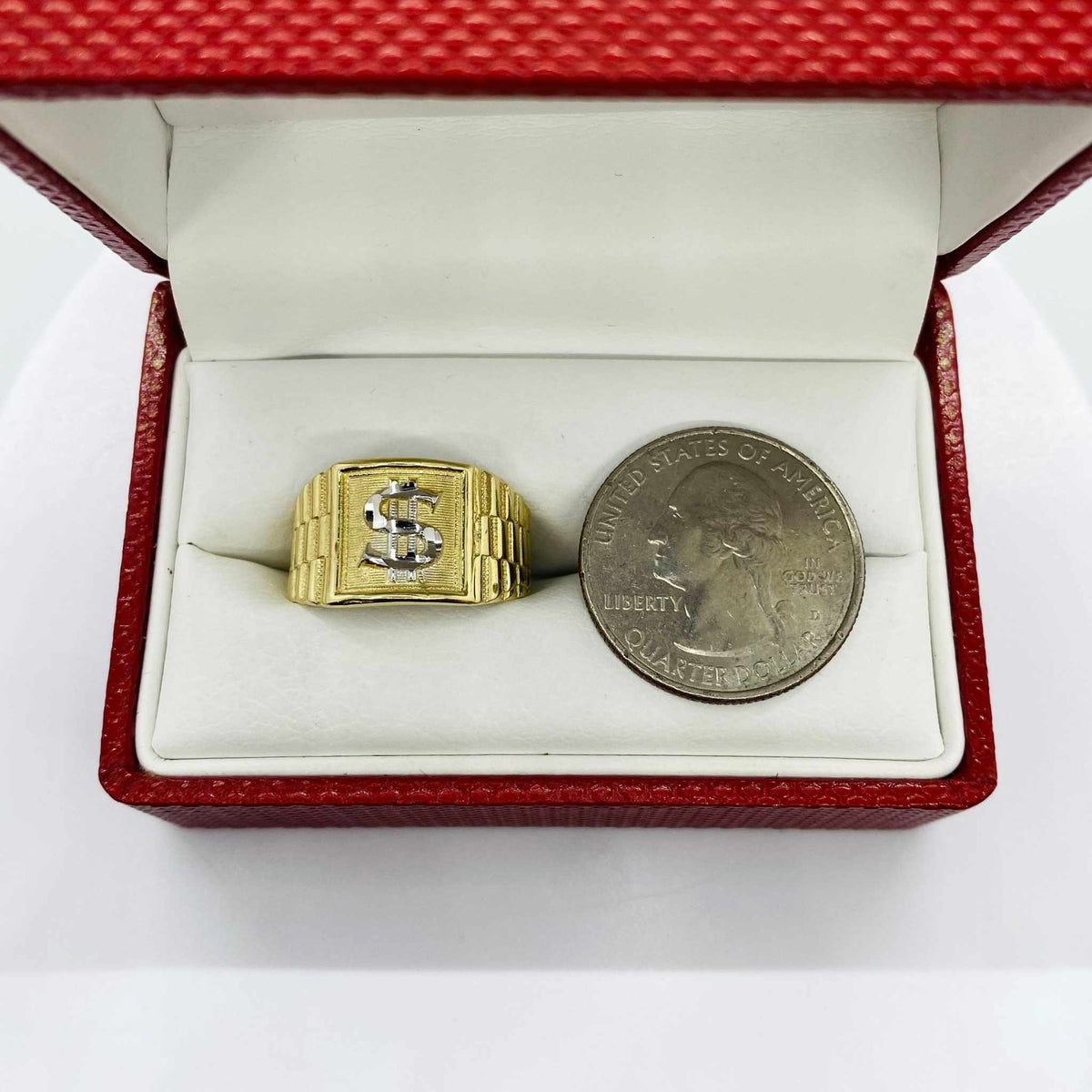 10k - 14k Gold Rollie Band ring with dollar sign design next to a quarter in an open red box.