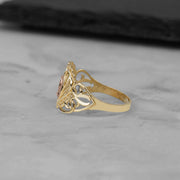 Side profile of the 10k and 14k gold Elyra heart Virgin Mary ring.