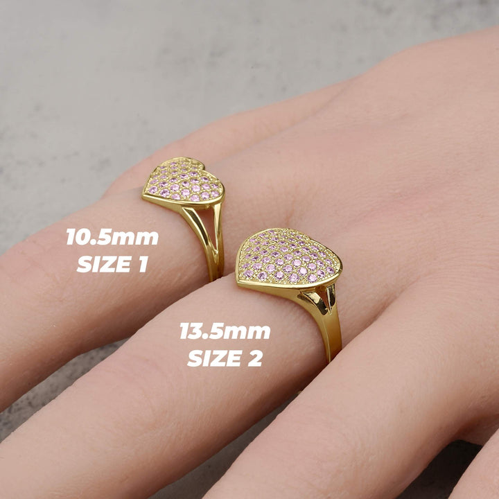 Gold convex heart rings in Size 1 and Size 2 displayed on a hand.