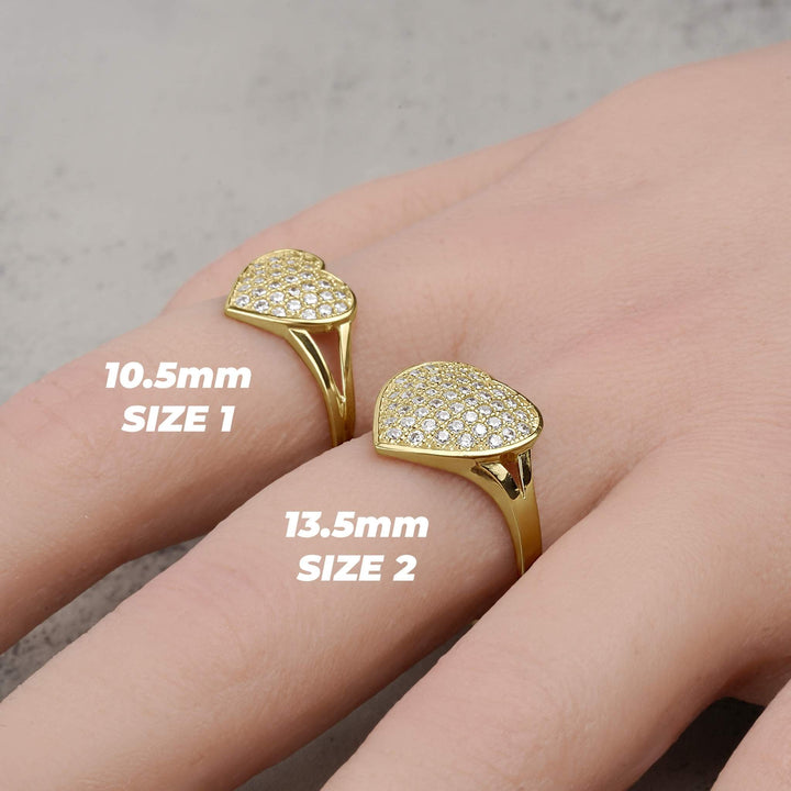 Gold convex heart rings in Size 1 and Size 2 displayed on a hand.