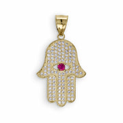 A gold Hamsa hand pendant covered in sparkling cubic zirconia stones with a central pink gemstone.