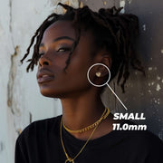 Female model wearing a small 11.0mm gold heart nugget stud earring.