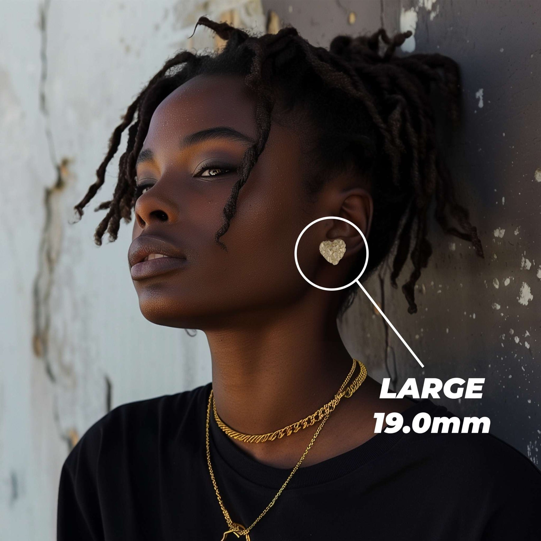 Female model wearing a large 19.0mm gold heart nugget stud earring.
