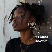 Female model wearing an X Large 25.0mm gold heart nugget stud earring.