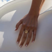 On-hand view of a women's 10k or 14k gold floral heart initial letter A ring.