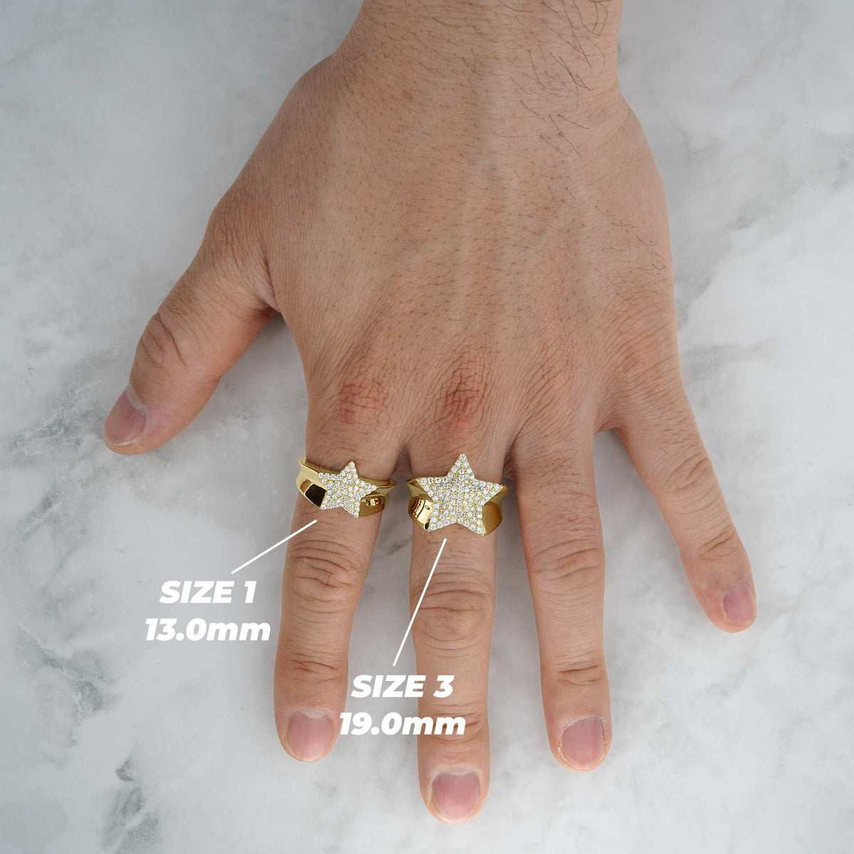 10k-14k gold celestial star rings in Size 1 and Size 3 shown on fingers.