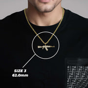 Lifestyle photo of a man wearing the Size 3 62.0mm gold AK-47 pendant.