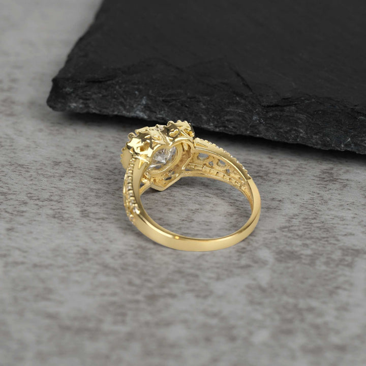 10k - 14k Gold ring with intricate design back view on a gray surface