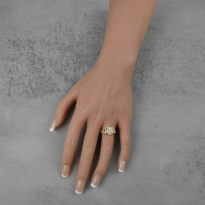 10k - 14k Hand wearing a  Quinceanera Heart ring on a gray background