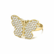 Three-quarter view of a gold cubic zirconia butterfly ring on a white background.