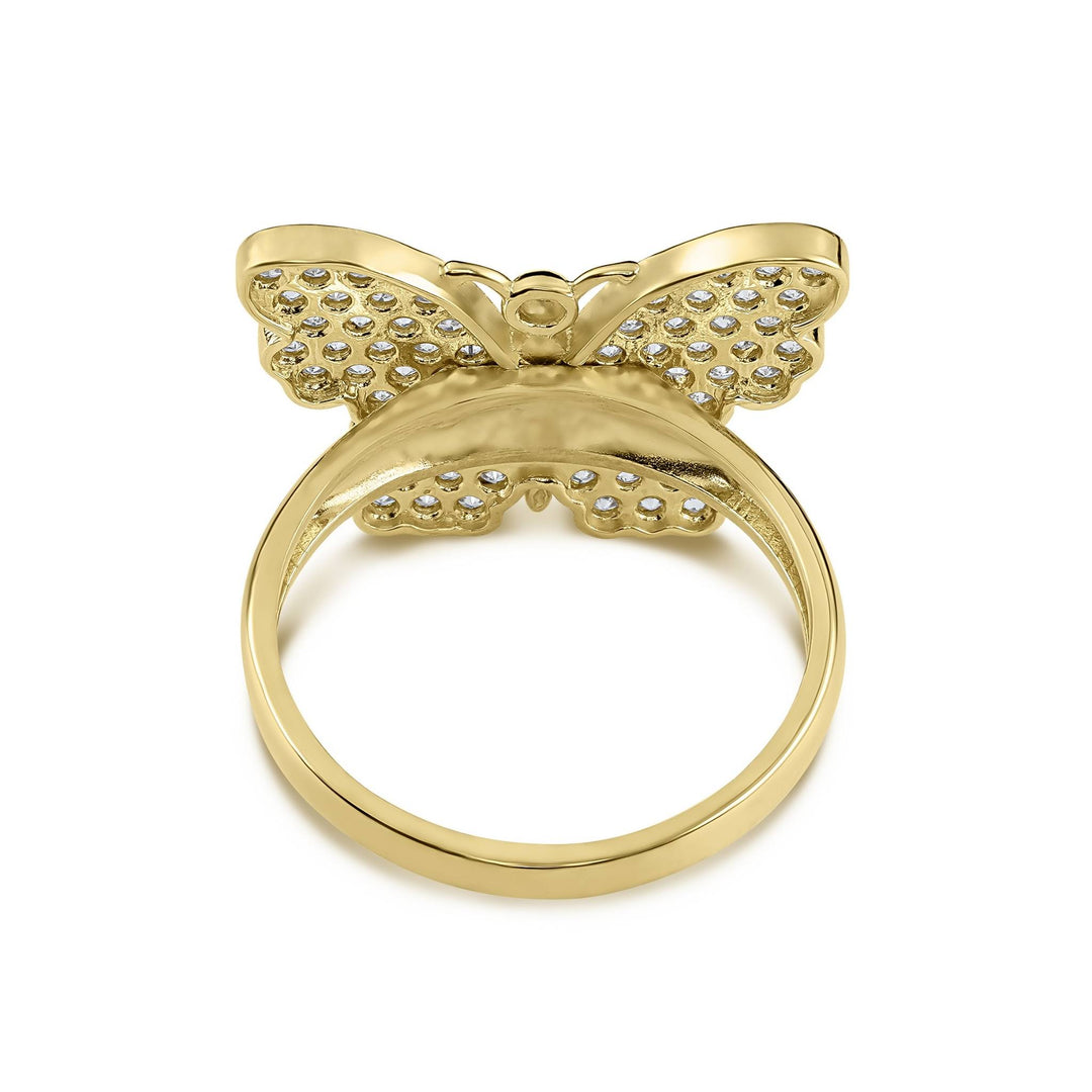 Backside view of a gold cubic zirconia butterfly ring against a clean background.