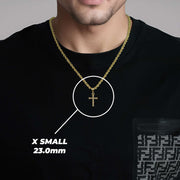 Man wearing a gold cross pendant necklace with text overlay reading X SMALL 23.0mm.