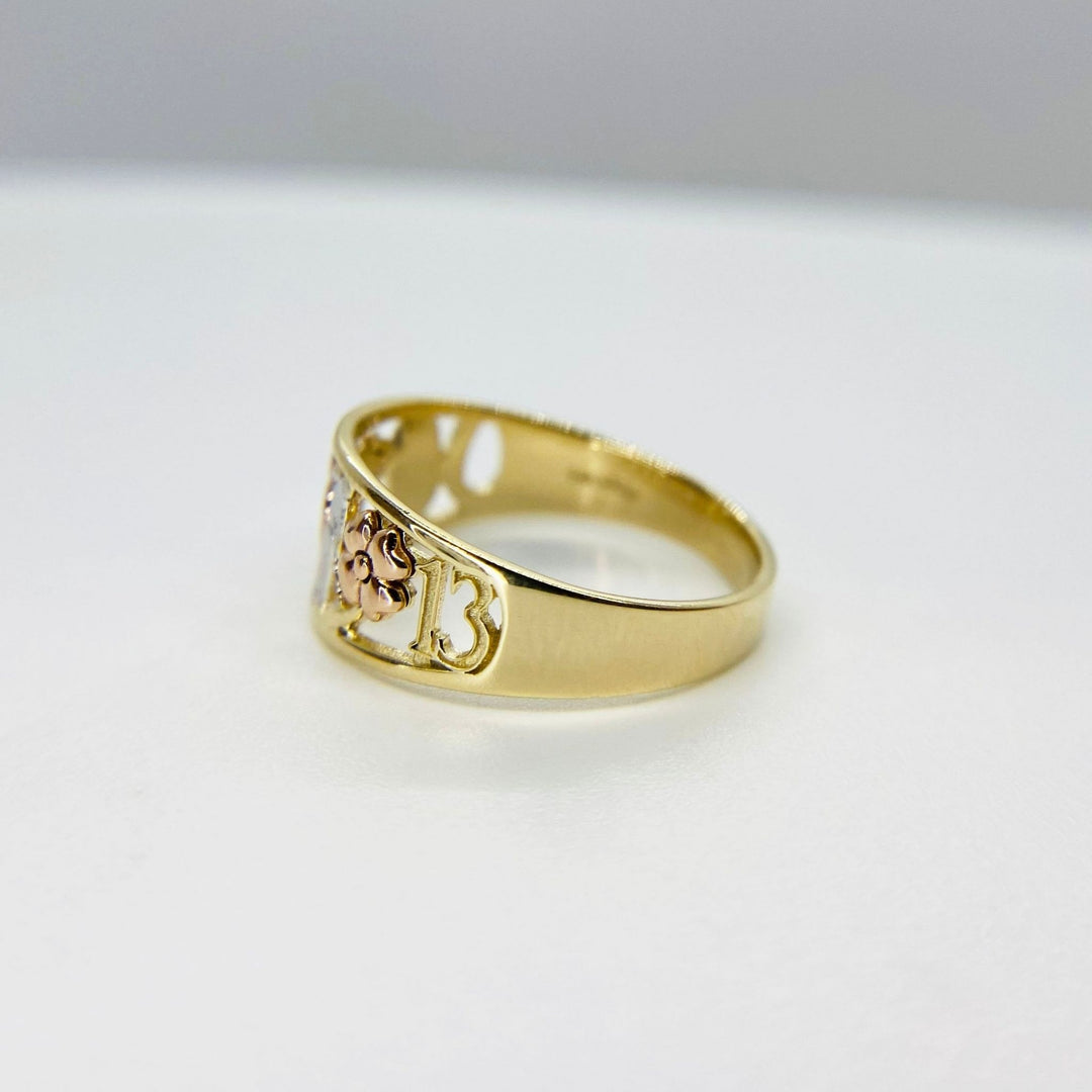 10k - 14k Gold ring with rose gold design side view on a white background