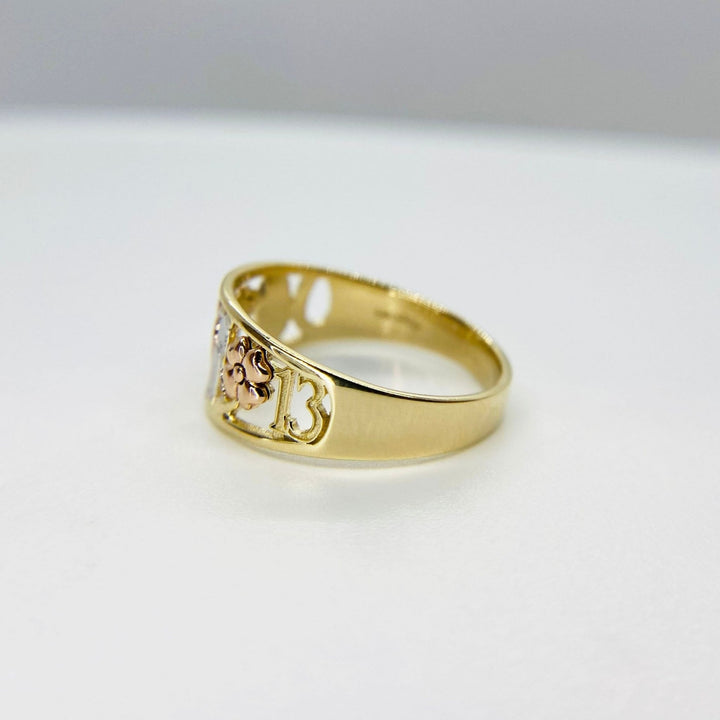 10k - 14k Gold ring with rose gold design side view on a white background