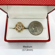 10k - 14k Gold ring with Virgin Mary Guadalupe design next to a quarter.