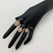 Three 10k - 14k gold Virgin Mary Guadalupe rings on a black mannequin hand.