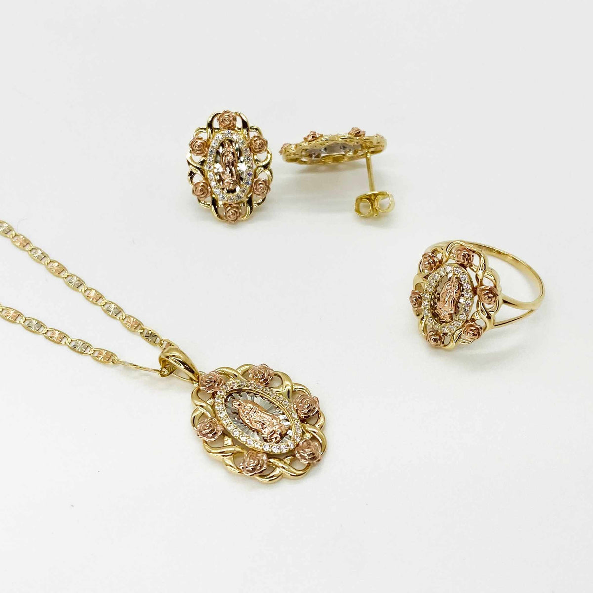10k - 14k Gold Virgin Mary Guadalupe jewelry set on a white background