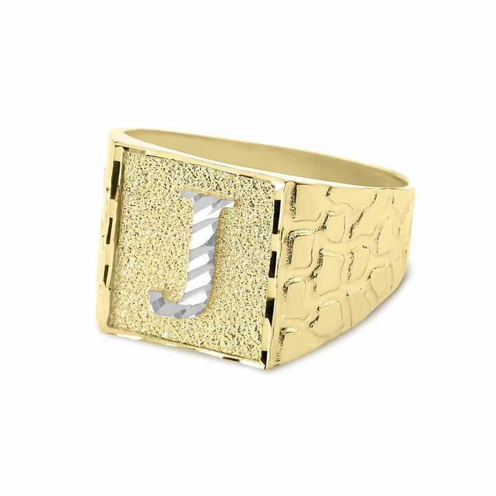 Side angle of men's gold square nugget ring with white gold initial J emblem.