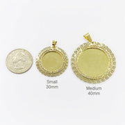 Small 30mm and medium 40mm round CZ gold picture pendants next to a quarter.