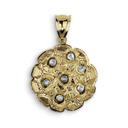 Smooth polished back of the round nugget pendant featuring clean lines and a classic bail.