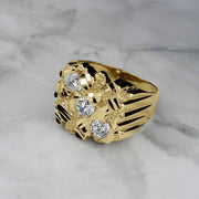 A gold classic square nugget ring featuring three vertical cubic zirconia accents on marble.