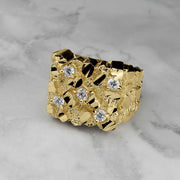 A gold classic square nugget ring featuring five clear cubic zirconia accents on marble.