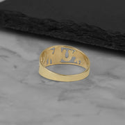 Top-angle shot of the 10k or 14k yellow gold lucky motif ring.