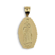 Gold-toned religious pendant featuring a textured, engraved depiction of Our Lady of Guadalupe.