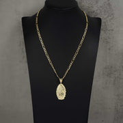 Gold chain necklace with an oval Guadalupe pendant displayed on a black jewelry mannequin bust.