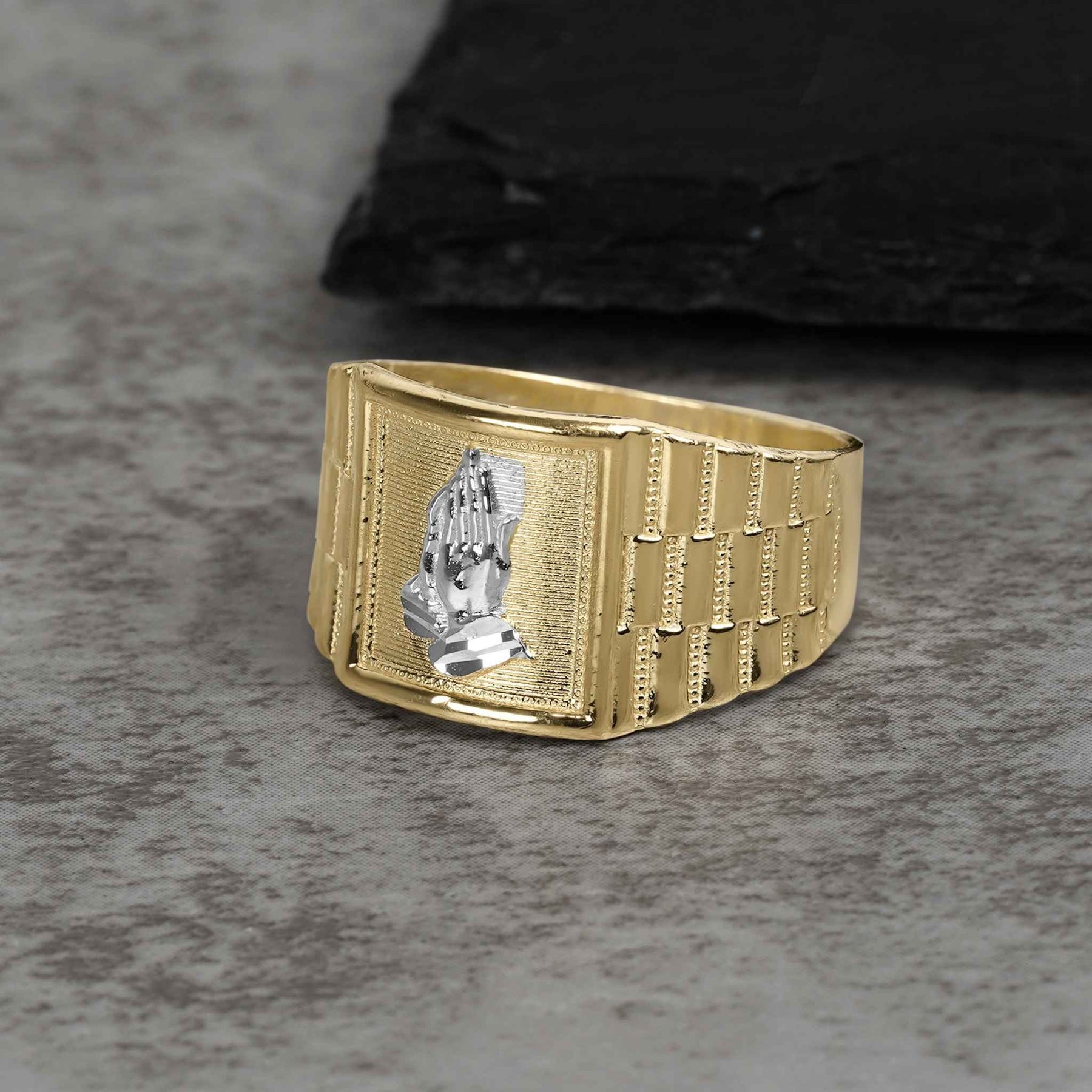 Yellow gold Rolex-style ring featuring a detailed white gold praying hands emblem on top.