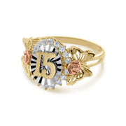 Angled view of tri-color gold Quinceañera Blanco ring with roses and butterflies.