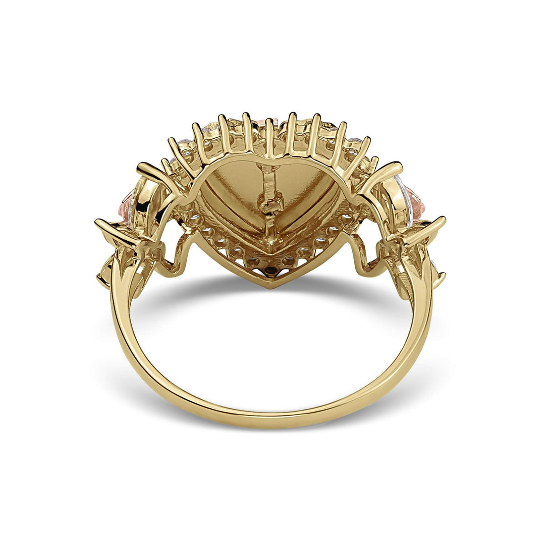 Back view of a gold two-tone Blingin heart Quinceañera ring on white background.