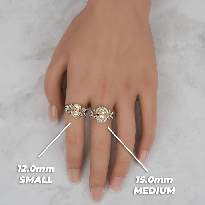 Model displaying small and medium sizes of a tricolor gold birthday ring.