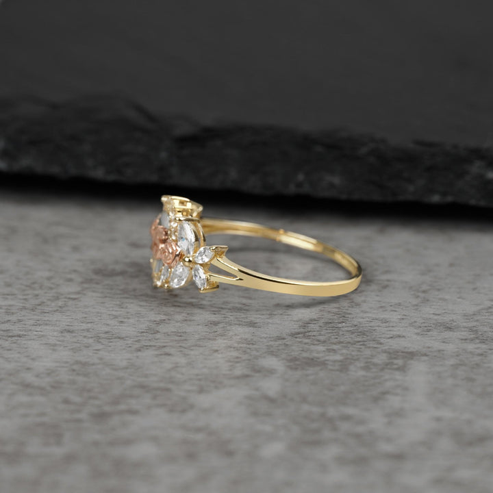 10k - 14k Gold ring with floral design on a gray surface