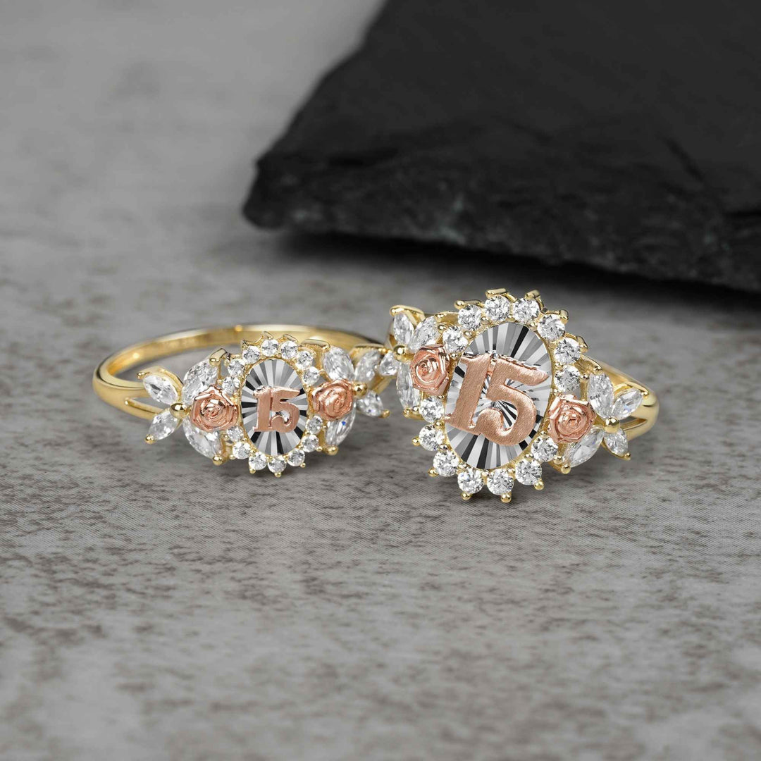 10k - 14k Two rose gold rings with 15 design on a gray surface