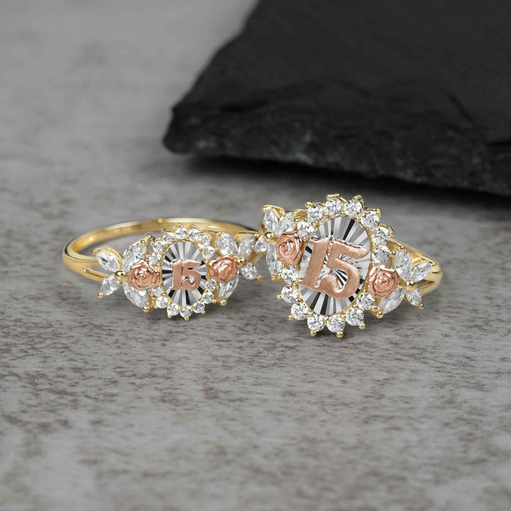 10k - 14k Two rose gold rings with 15 design on a gray surface