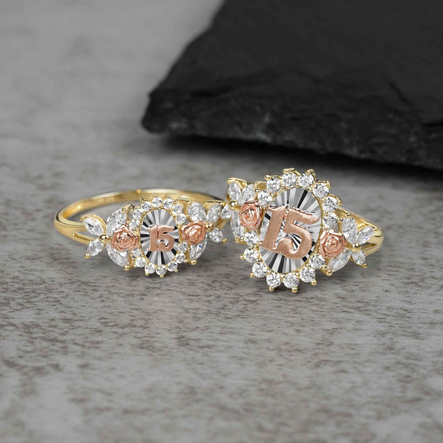 10k - 14k Two rose gold rings with 15 design on a gray surface