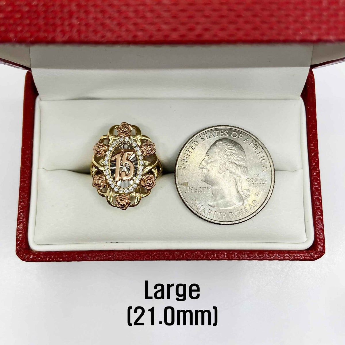 10k - 14k Gold  Quinceanera Bloom Rose ring next to a silver coin.
