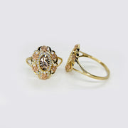 Two 10k - 14k gold Quinceanera Bloom Rose Tri-Color Ring with intricate designs.