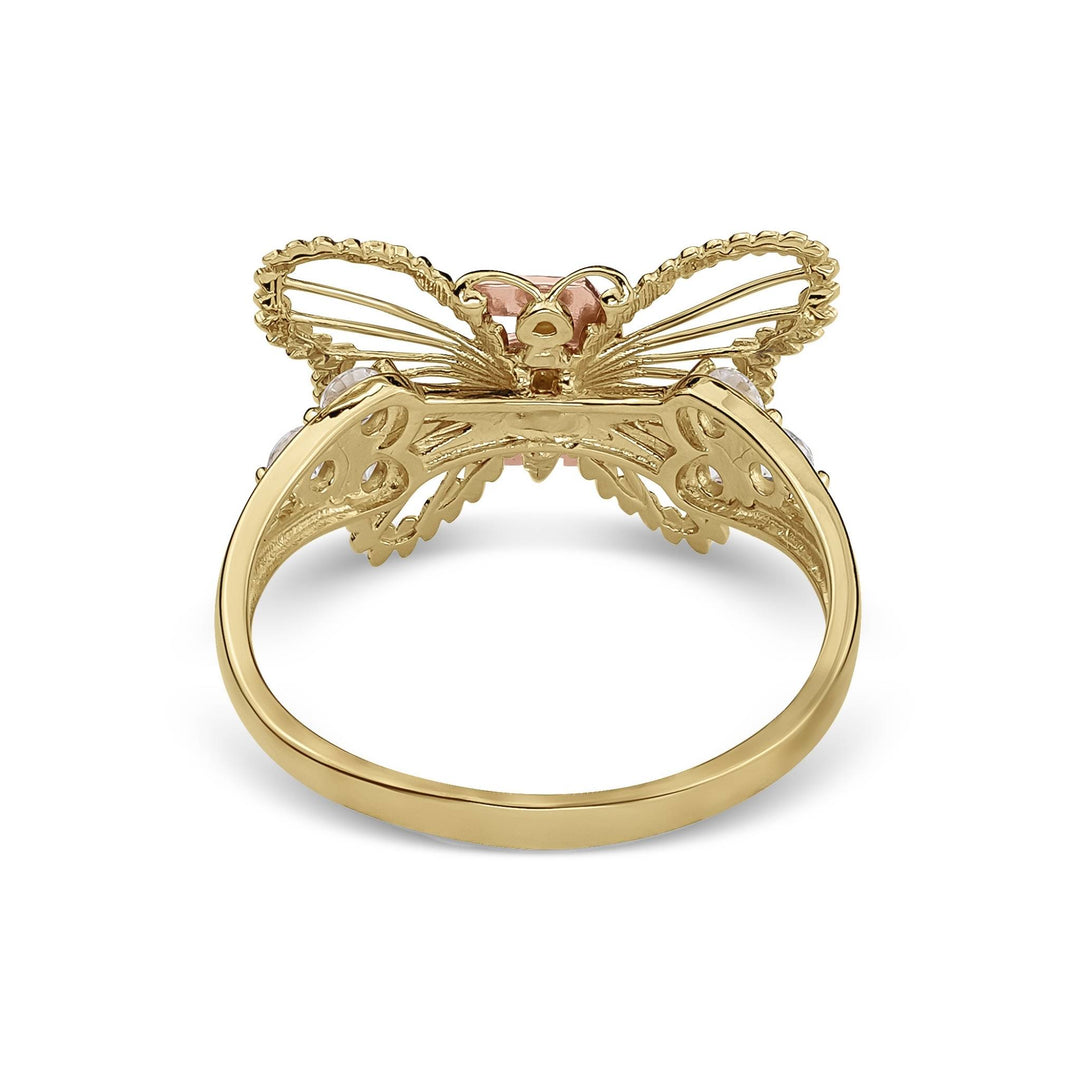 Back view of a gold two-tone classic butterfly Quinceañera ring on white background.