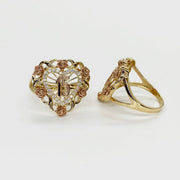 two 10k - 14k Gold Quinceanera ring with heart design and rose accents on a light background