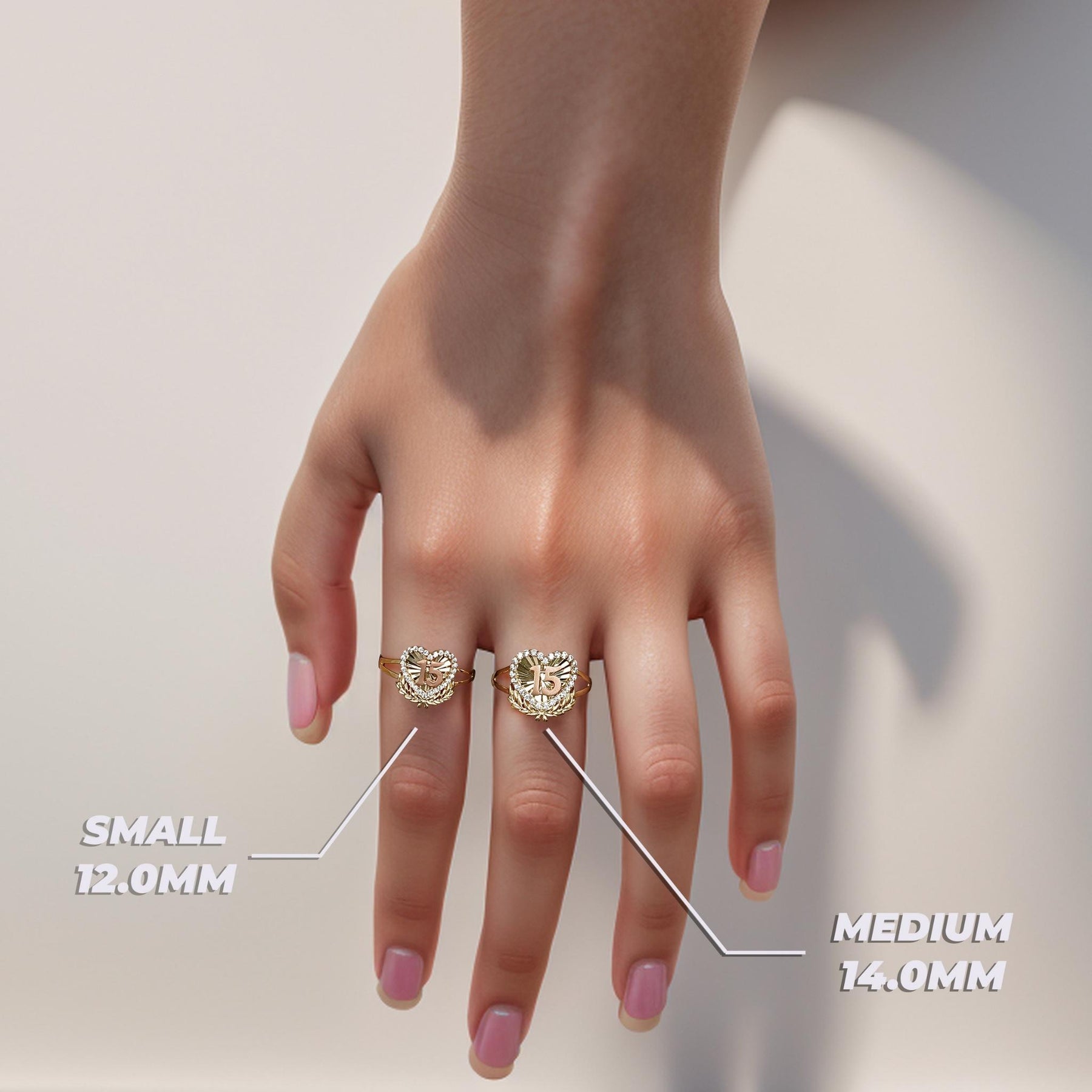 10k 14k gold quinceanera two-tone heart wing rings on hand with size labels.